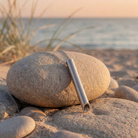 Fermata Chime steel breathing pendant in a calm, minimal setting